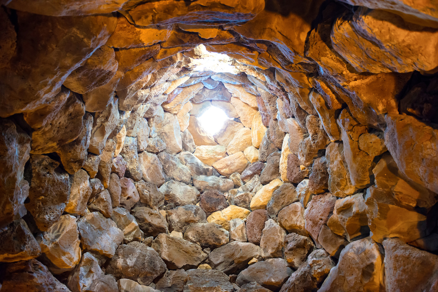 Inside the ancient tower well. Nuraghe culture, Sardinia, Italy