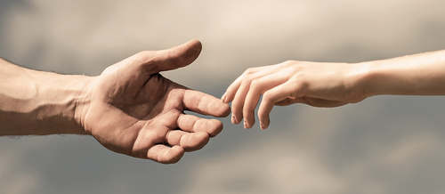 Hands of man and woman reaching to each other, support. Hands of man and woman on blue sky background. Giving a helping hand. Lending a helping hand. Solidarity, compassion, and charity, rescue / Yevhen - stock.adobe.com Hands of man and woman on blue sky background. Giving a helping hand. Lending a helping hand. Solidarity, compassion, and charity, rescue.